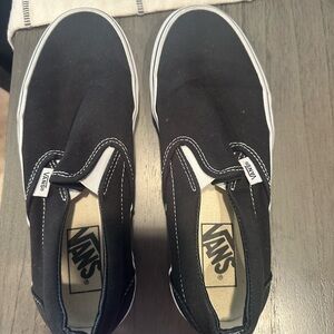 Vans women’s Black Canvas Slip-On Sneakers